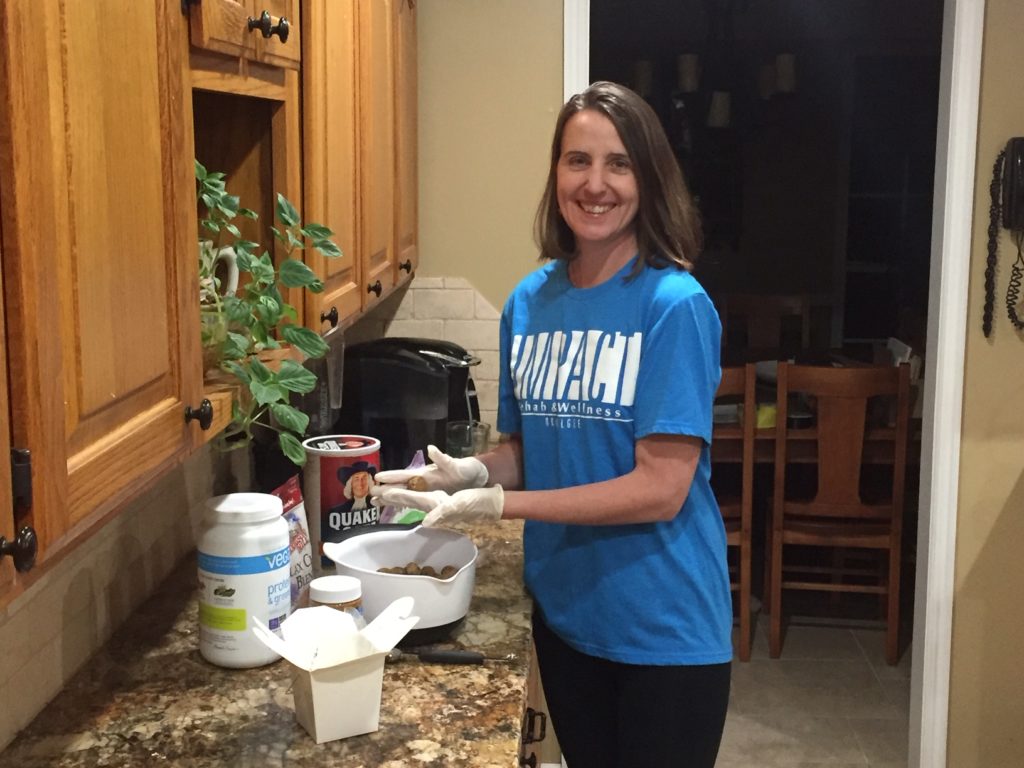 Kris Siegenthaler in the kitchen making Protein Peanut Butter Chocolate Energy Balls. 